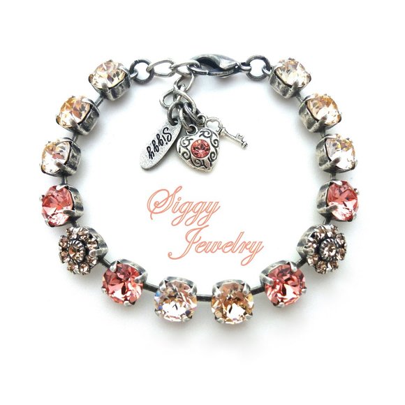 Austrian Crystal Tennis Bracelet with Flower Embellishments in Peachy Colors - Picture 1 of 8